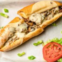 Philly Cheese Steak Sandwich · Thin sliced sauteed shaved Philly steak meat with melted mozzarella cheese topped with green...