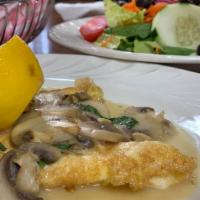Chicken Francese · Lightly egg battered and sauteed with fresh mushrooms in a lemon wine sauce.