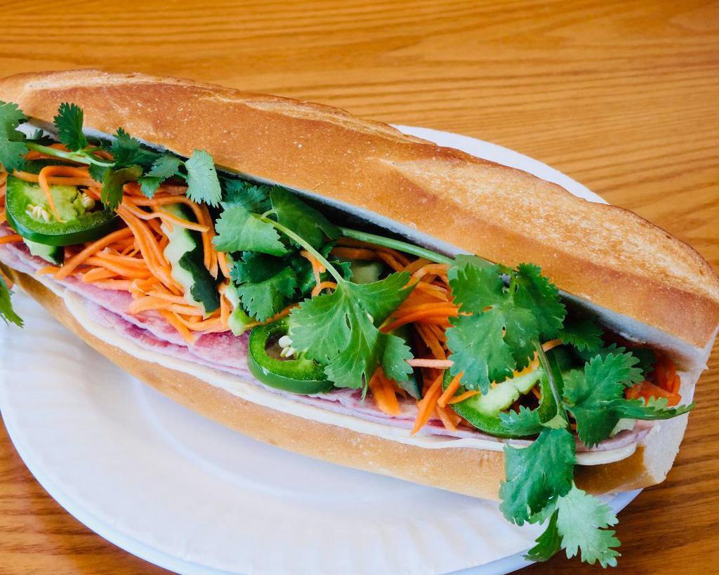 S1. Traditional sandwich - Bánh mì thịt nguội · Traditional Vietnamese sandwich with pate spread, cold cut pork roll and ham