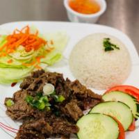 R6. Lemongrass Beef with White rice - Cơm bò xào sả · Tender lemongrass beef.  Served with house fish sauce on the side