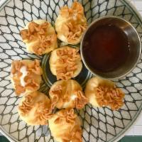 Crab Cream Cheese Puff (8) · Deep-fried imitation crab and cream cheese wrapped in wonton wrapper served with sweet & sou...