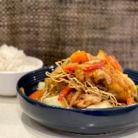Crispy Snapper · Triple flavor of sweet and sour stir fry with bell pepper and onion, topped with fillet cris...