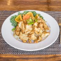 Crispy Chicken Herb Fried Rice · Thai style fried rice, topped with crispy chicken and Thai herb served with sweet & sour sauce