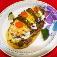 Huarache  · Hand made tortilla, Choice of meat, beans, cheese grilled onions, Pico de gallo, sour cream ...