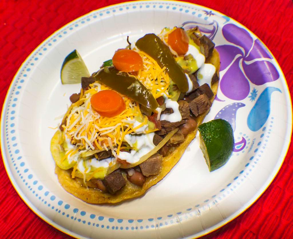 Huarache  · Hand made tortilla, Choice of meat, beans, cheese grilled onions, Pico de gallo, sour cream and Salsa.