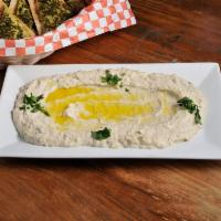 Baba Gannouj Dinner · Tangy roasted eggplant spread with garlic, lime and tahini. Served with pita. Vegetarian.