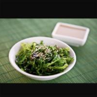 S5. Seaweed Salad · Green seaweeds with sesame seed marinated with sweet and sour sauce.