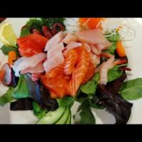 S8. Seafood Salad · Raw. Red snapper, crabmeat, salmon and tuna, fish roe on green salad.