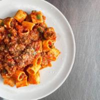 Rigatoni Bolognese · Rigatoni Pasta + House Made Meat Sauce + Basil + Parmesan