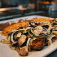Steak Poblano · SKIRT STEAK. Served with poblano peppers, onions, mushrooms and creamy sauce. Served with ri...