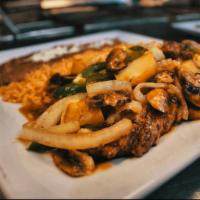 Steak Texano · Rib Steak. Served with sauteed onions, mushrooms, fresh jalapenos and potatoes. Served with ...