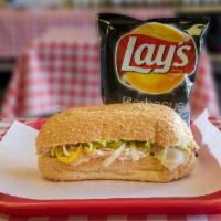 Turkey Breast Sandwich · Turkey breast (oil-browned), lettuce, mild peppers, with mustard and mayonnaise.