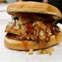 Urban Cowboy Chicken Sandwich · Grilled chicken with provolone, bacon, grilled onions, and sauce.