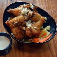 Wings · 1LB of Chicken Wings with your choice of Classic Buffalo, Thai Chili, or Garlic Parm. Served...