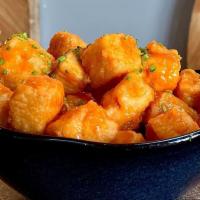 Tofu Wings · Fried Tofu with your choice of Classic Buffalo, Thai Chili, or Garlic Parm. Served with Bleu...