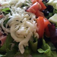 Chef Salad · Mix greens, pepperoni, ham, mozzarella cheese, black olives, cucumbers, and tomatoes.