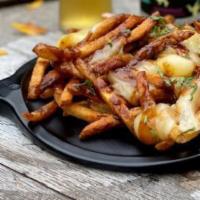 Burnt Ends Poutine · House smoked brisket burnt ends, white cheddar cheeses curds, gravy all over our house handc...