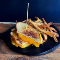 Grilled Cheese Sandwich · Served with melted cheddar and munster on sourdough bread.