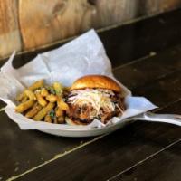 Pulled Pork Sandwich · House-smoked pulled pork, Alehouse BBQ sauce, country slaw. Served with hand-cut fries or ta...