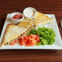 Carnitas Quesadillas · Pulled pork, pepper jack cheese, jalapenos, onions, topped with
lettuce. tomato, sour cream,...