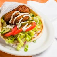 Falafel Gyro · Freshly deep-fried falafels, topped with tahini sauce and wrapped in a soft, warm pita.
