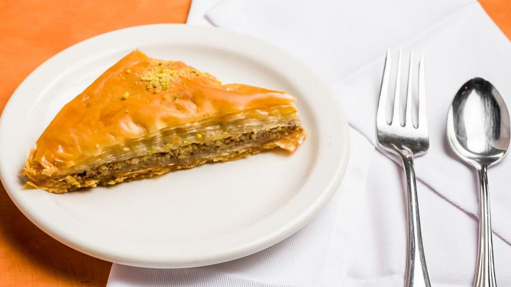 Baklava with Walnuts · Delicate layers of filo pastry filled with walnuts and pistachio, moistened with a light sugar syrup.