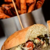 Rajas Con Queso y Carne Asada Sandwich · Pan de yema bread, sliced prime skirt steak, melted manchego cheese sauce, roasted poblanos,...