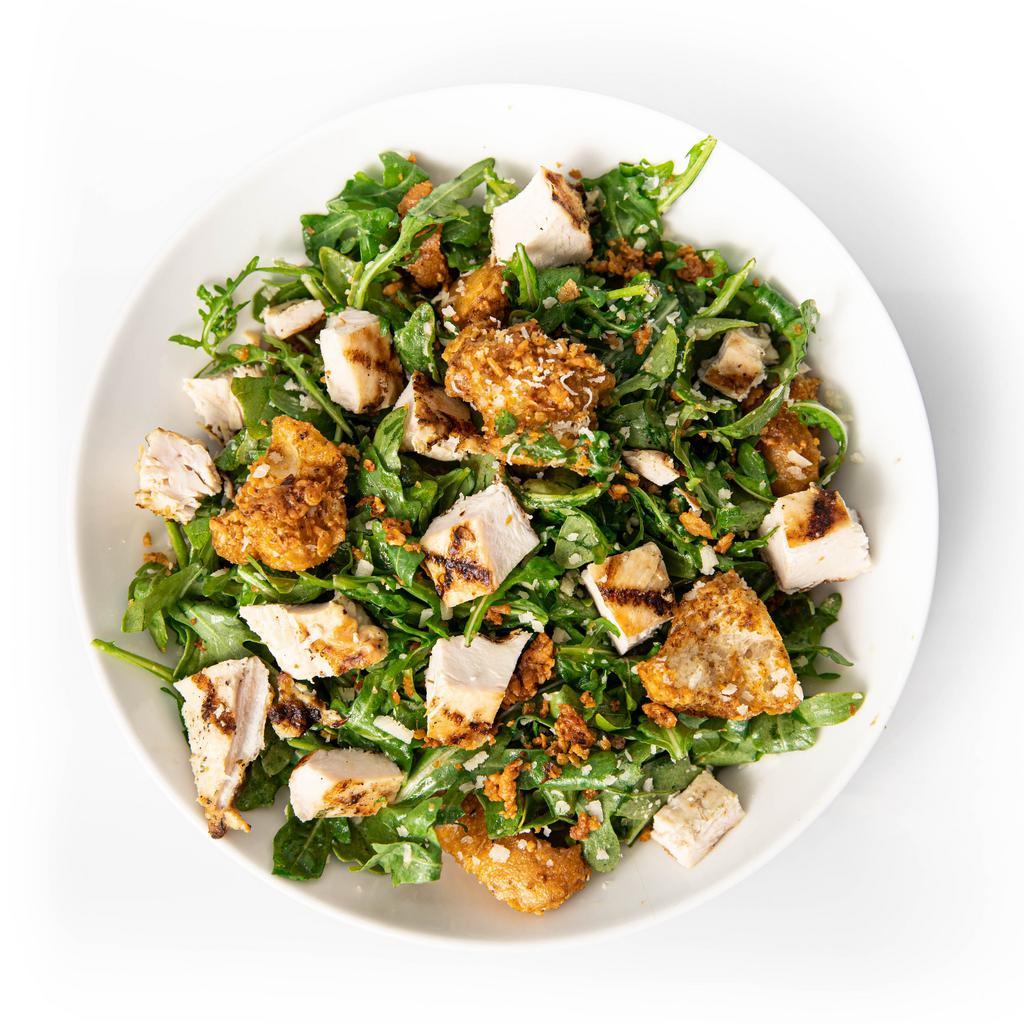 Arugula Parm Salad with Chicken · Baby arugula, homemade butter croutons, freshly shaved parmesan, sherry dressing,
and diced grilled chicken. 