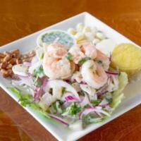 Ceviche Mixto · Strips of fish and seafood marinated in lime juice and onions.