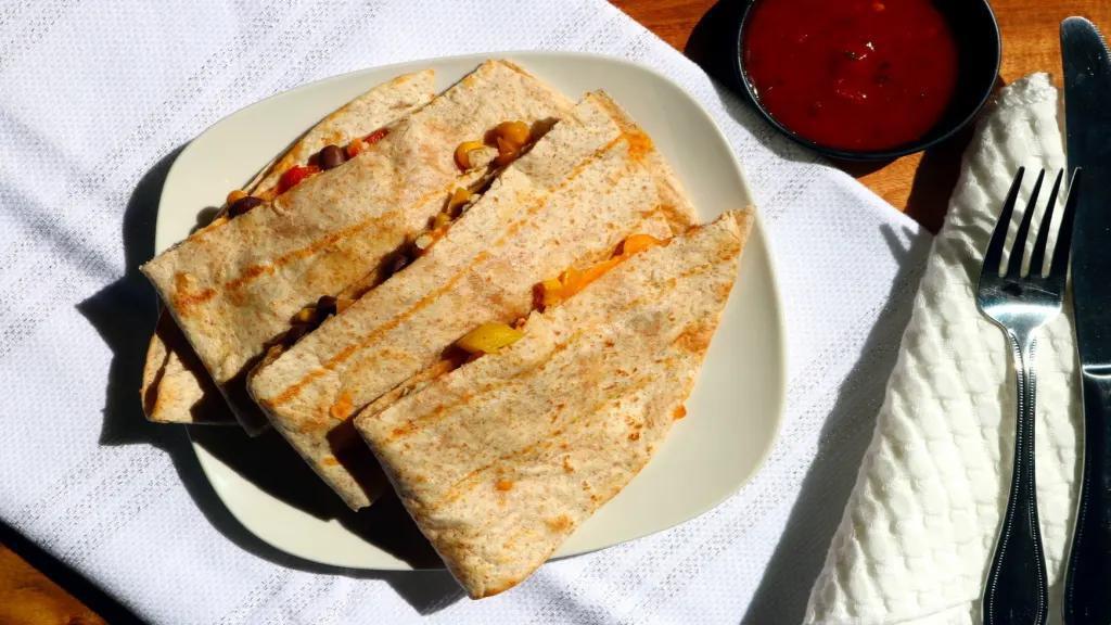 Baja Quesadilla · Chicken, peppers, black bean corn salsa, cheddar. Served with ranch and salsa.