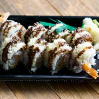 Shrimp Tempura Roll · Shrimp tempura and crab salad with eel sauce and tempura crunch.