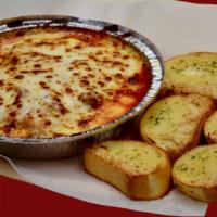 Lasagna · With 5 pieces of garlic bread.