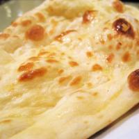 69. Naan · Flat leavened bread baked on the walled timing of a clay oven.