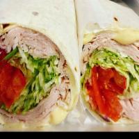 Honey Turkey specialty Wrap · Honey turkey, honey mustard, American, lettuce, tomato and onions. Served with chips and a p...