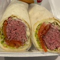 Roast Beef specialty Wrap · Roast beef, provolone, horseradish sauce, lettuce, tomato and onions. Served with chips and ...