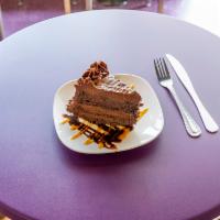 Double Chocolate Cake · 2 layers of moist chocolate cake, filled with luscious milk chocolate icing, then covered wi...