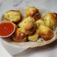 Garlic Knots · Homemade twisted dough baked with fresh garlic, extra virgin olive oil, Italian spices, and ...