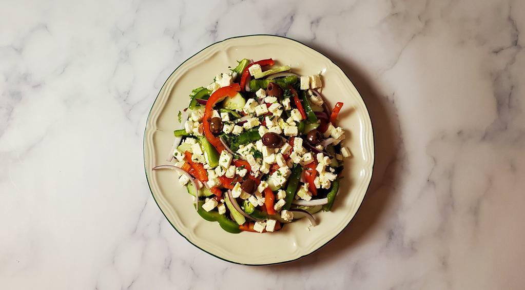 Greek Salad · Mixed greens, cherry tomatoes, cucumber, red onions, kalamata olives, green peppers, feta, & balsamic dressing