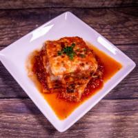 Lasagna al Forno · Layers of pasta, ground beef and Italian sausage, ricotta cheese, Parmesano, cheese Romano, ...