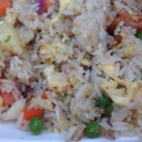 H12. Pineapple Fried Rice · Chicken, beef or shrimp, pineapple, cashews, carrots, peas and egg.