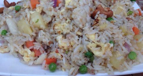 H12. Pineapple Fried Rice · Chicken, beef or shrimp, pineapple, cashews, carrots, peas and egg.