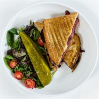 Hot Pastrami and Swiss · Served with salad and dill pickle.