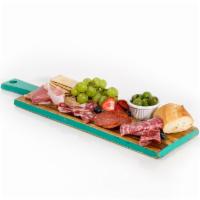 Cheese and Charcuterie Plate · 3 meats, three cheeses, bread, crackers, fruit, olives.