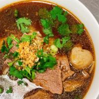 Beef Stew Noodle Soup · Rice noodle in beef broth with stewed beef, beef ball, sliced beef, bok choy, beansprout, gr...