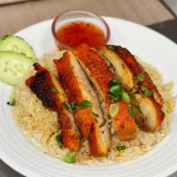BBQ Chicken Over Fried Rice · Fried rice with egg topped with Thai style BBQ chicken.