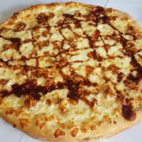BBQ Chicken Pizza · Marinated grilled chicken breast tossed in zesty BBQ sauce and topped with shredded mozzarel...