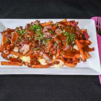 Smokehouse Poutine · Hand-cut fries topped with fresh cheese curds, house-smoked beef brisket, and smothered with...
