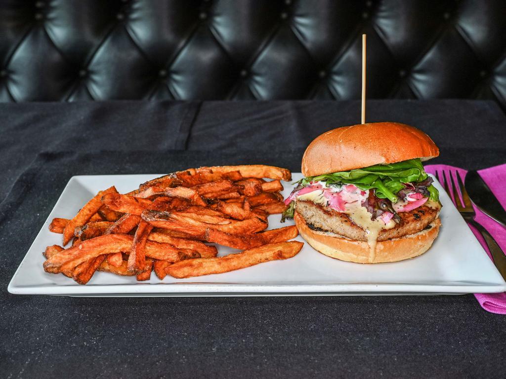 Turkey Burger · Our house-made turkey burger and duck bacon blend patty, topped with arcadian blend lettuce, pickled red onion, and Alabama sauce on a brioche bun.