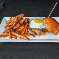Walk-O-Shame Burger Burger · Two Angus patties topped with American cheese, bacon, an over easy egg, served on a Maple bu...