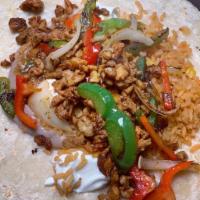 Fajita Burrito · Grilled bell peppers, onions, rice, beans, salsa, sour cream and choice of meat wrapped in a...